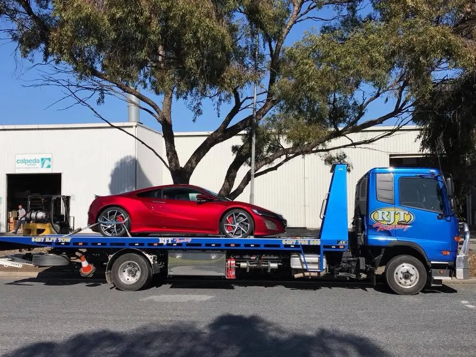 Red supercar on flatbed