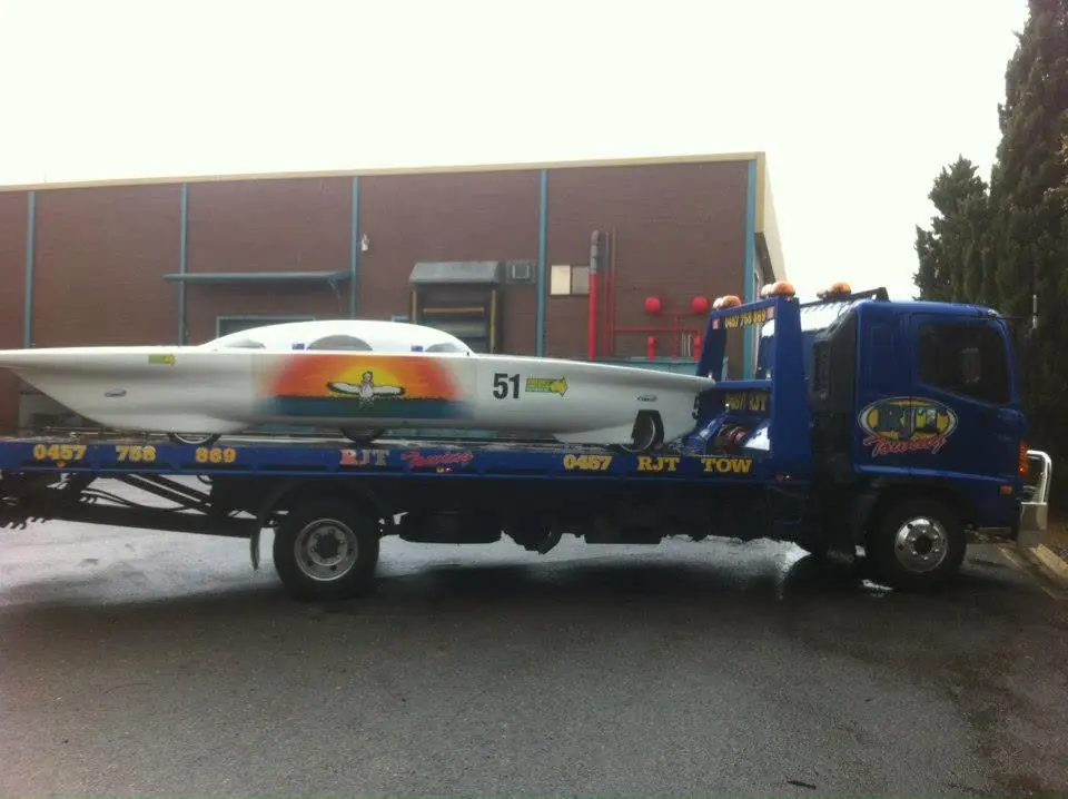 Yellow Honda NSX being towed